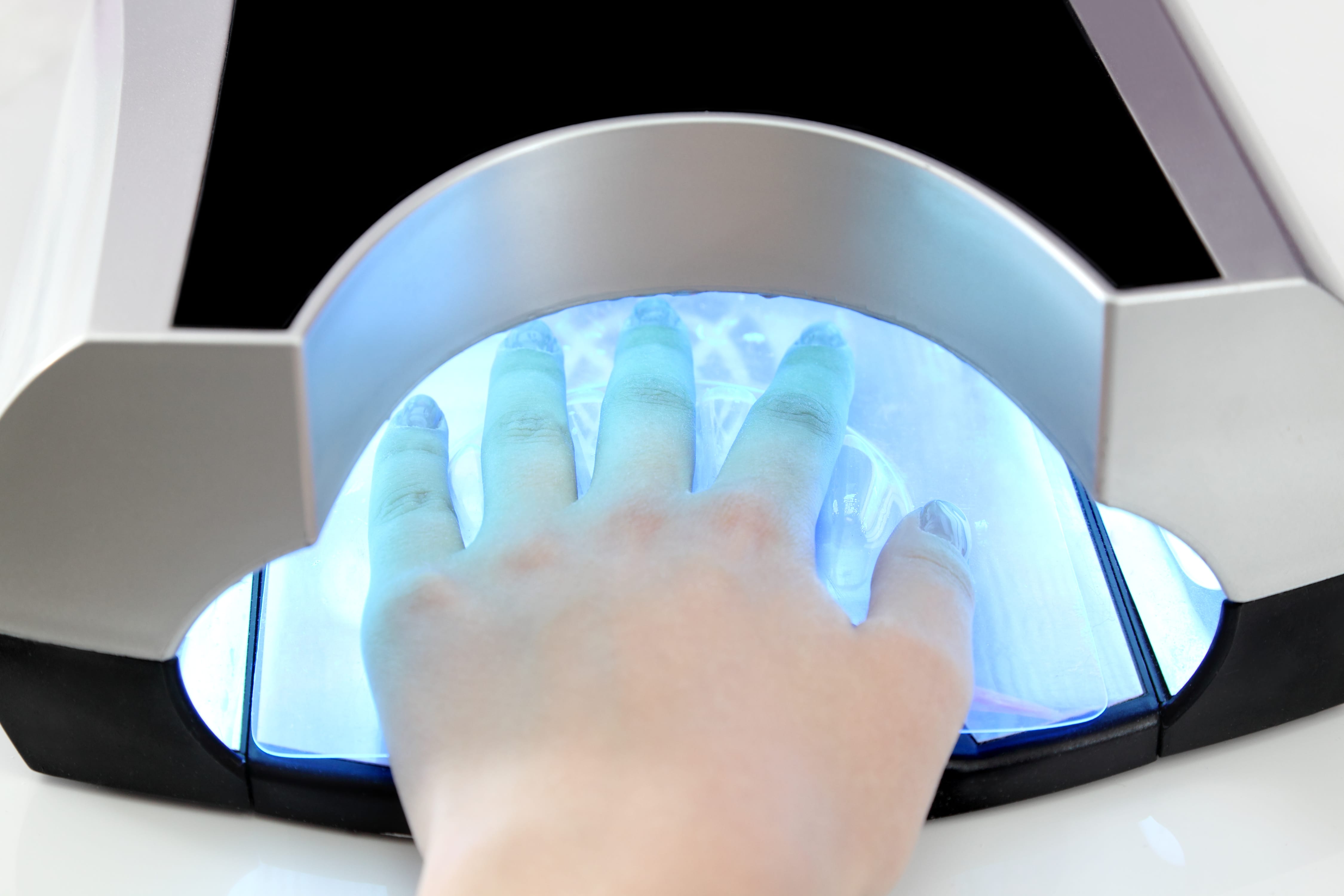 Finger nail treatment, lacquer dry with UV lamp, beauty makeup