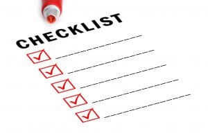 Checklist with red marker and checked boxes.