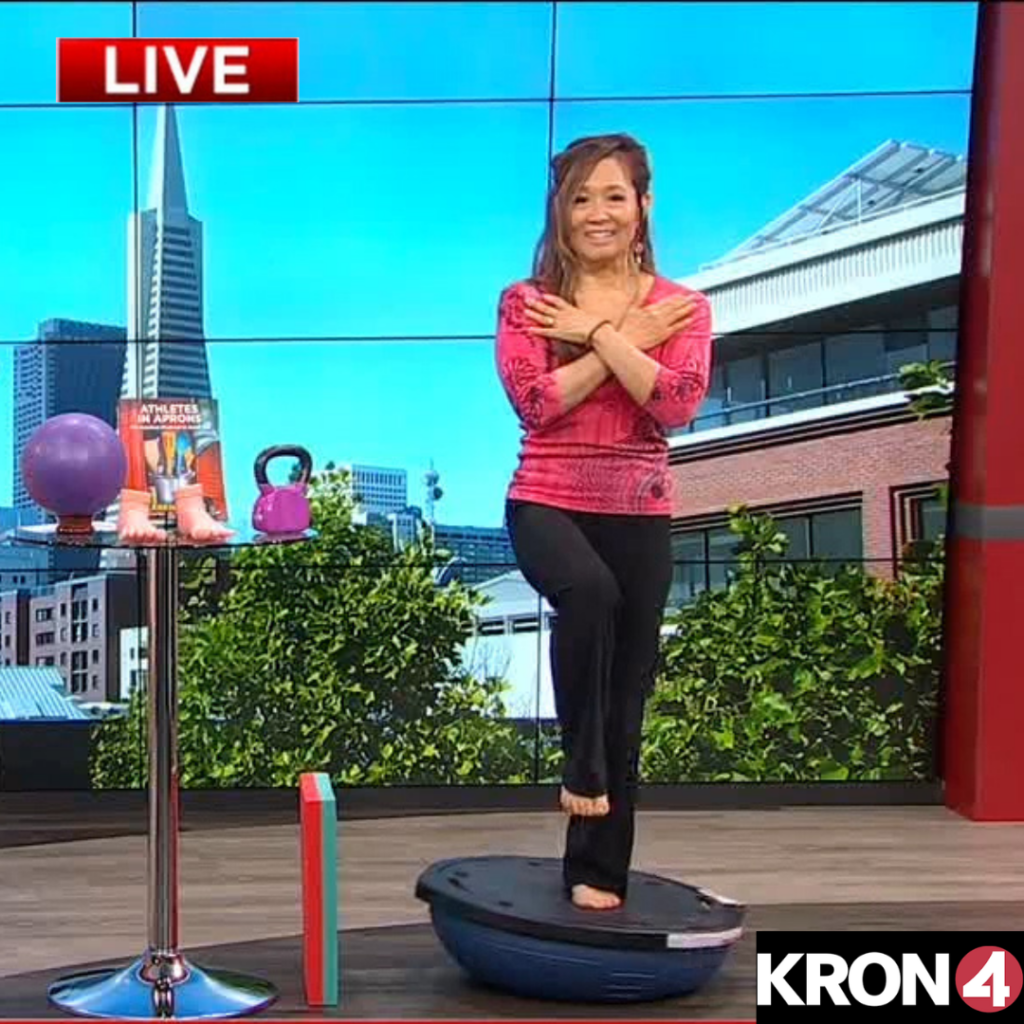 Karen Owoc is on a BOSU ball demonstrating how to assess brain health and improve balance